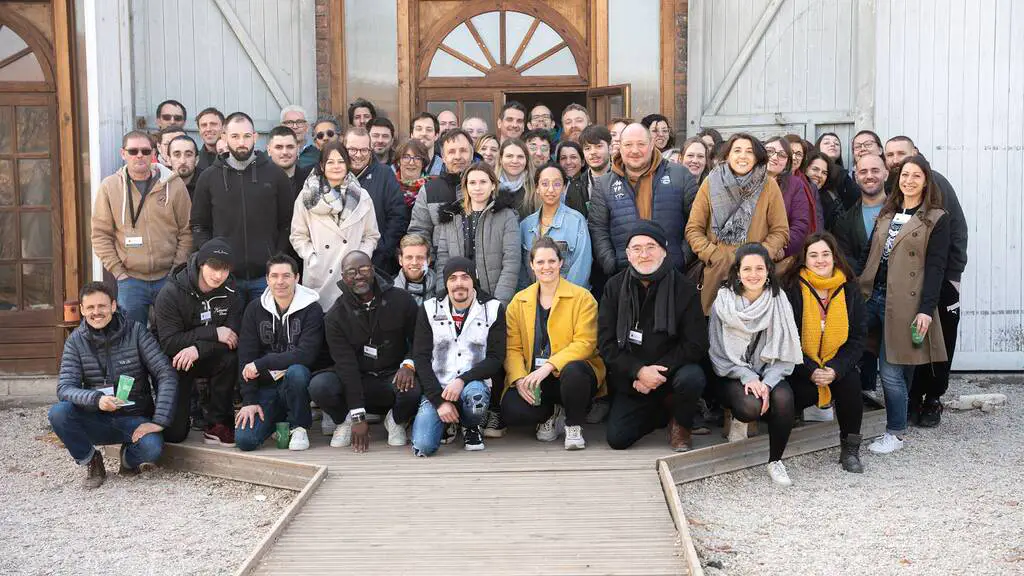 Group of diverse people posing together.