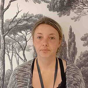 Woman in front of tree wallpaper.
